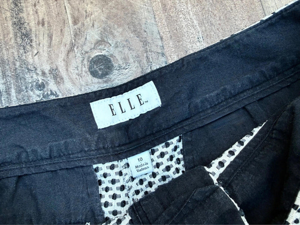 Elle black and white polka dot high-waist shorts with a scalloped hem size 10